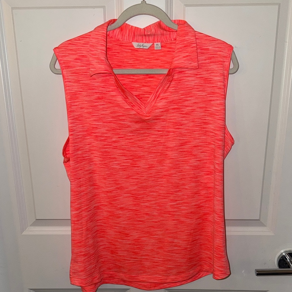 Lady Hagen women’s golf shirt in bright coral/orange